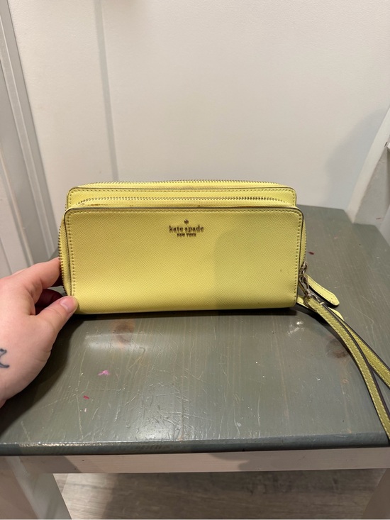 kate spade Handbags - kate spade yellow zip-around wristlet wallet
